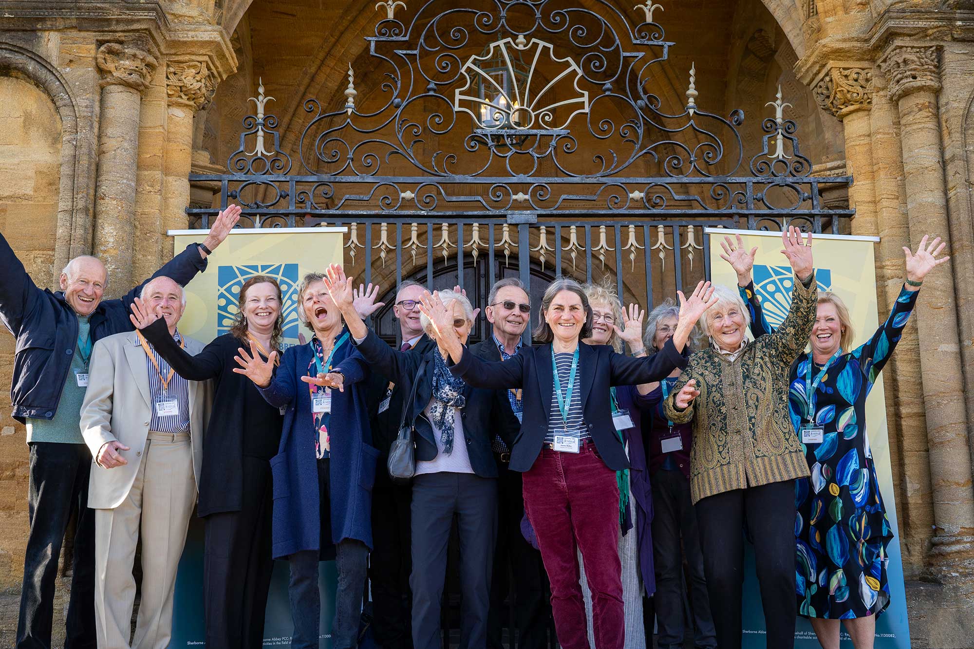 Group of volunteers outside Sherborne Abbey.